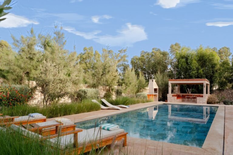 pool, loungers and blue sky