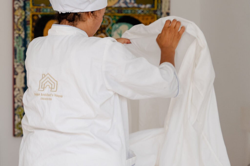 Housekeeping service in a guest bedroom